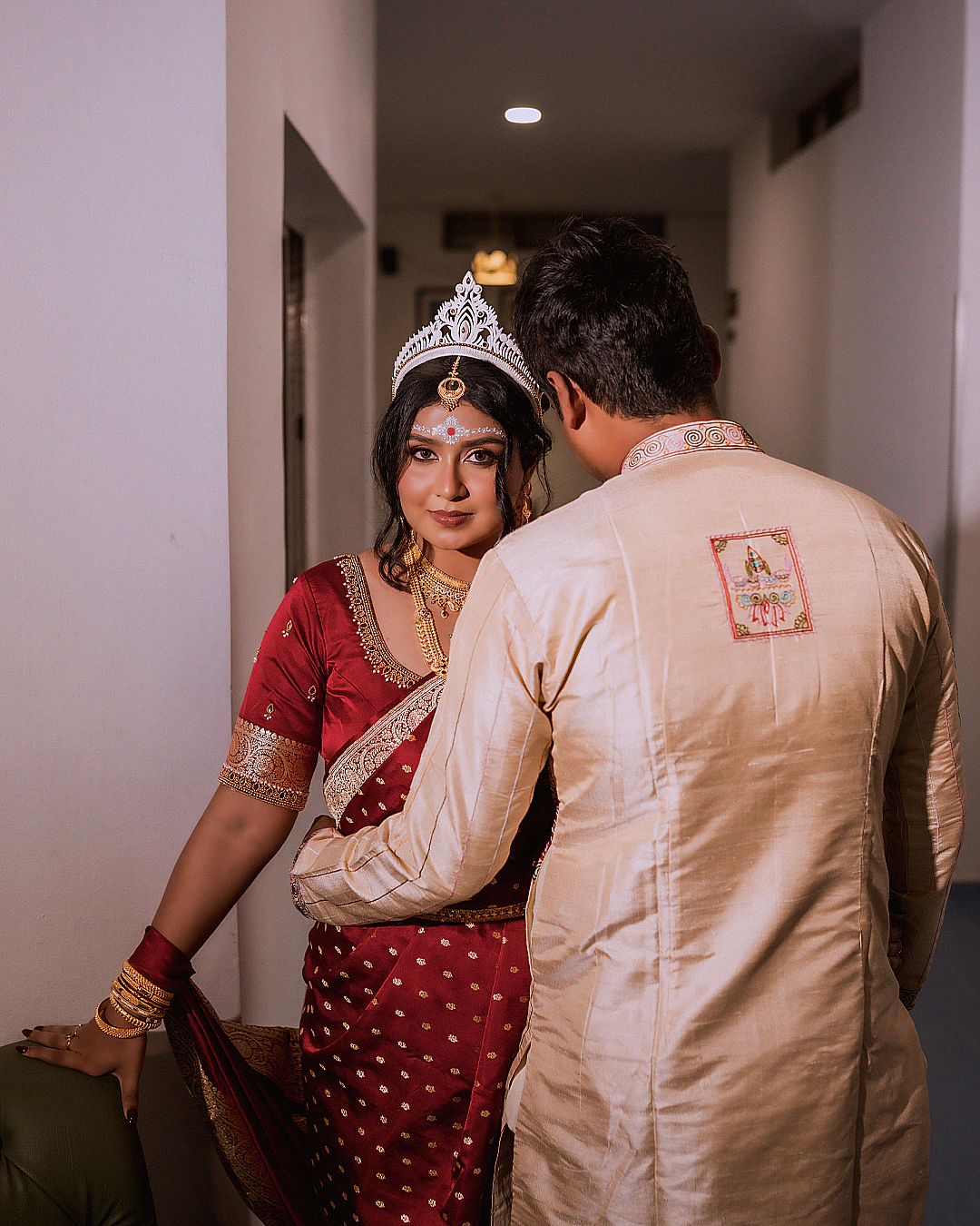 Chirasmitha and Akhil during their muhurtham ritual, captured candidly in natural light